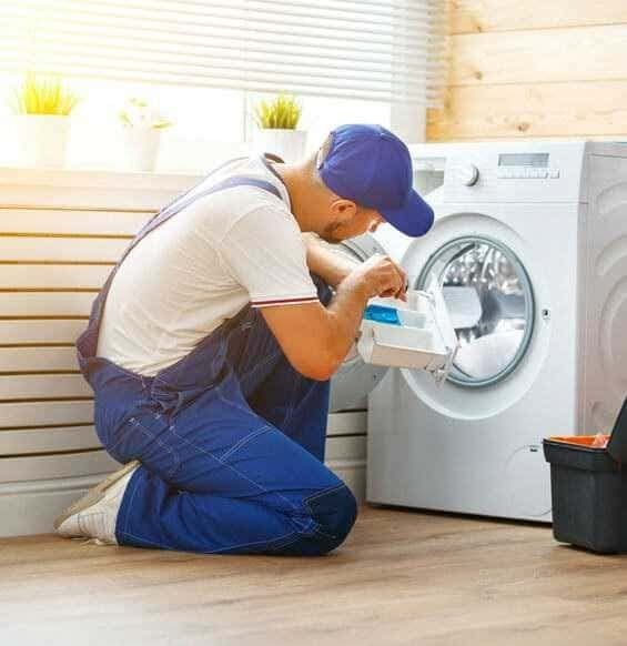 Technician checking a front-load washing machine
